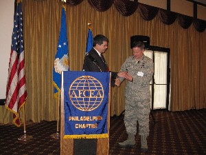 Mark Meaders (l), chapter chair, presents a token of thanks to Gen. Lord for speaking to the chapter in November.